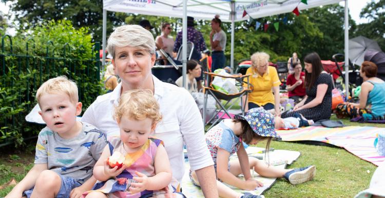 A mother and baby at a community event